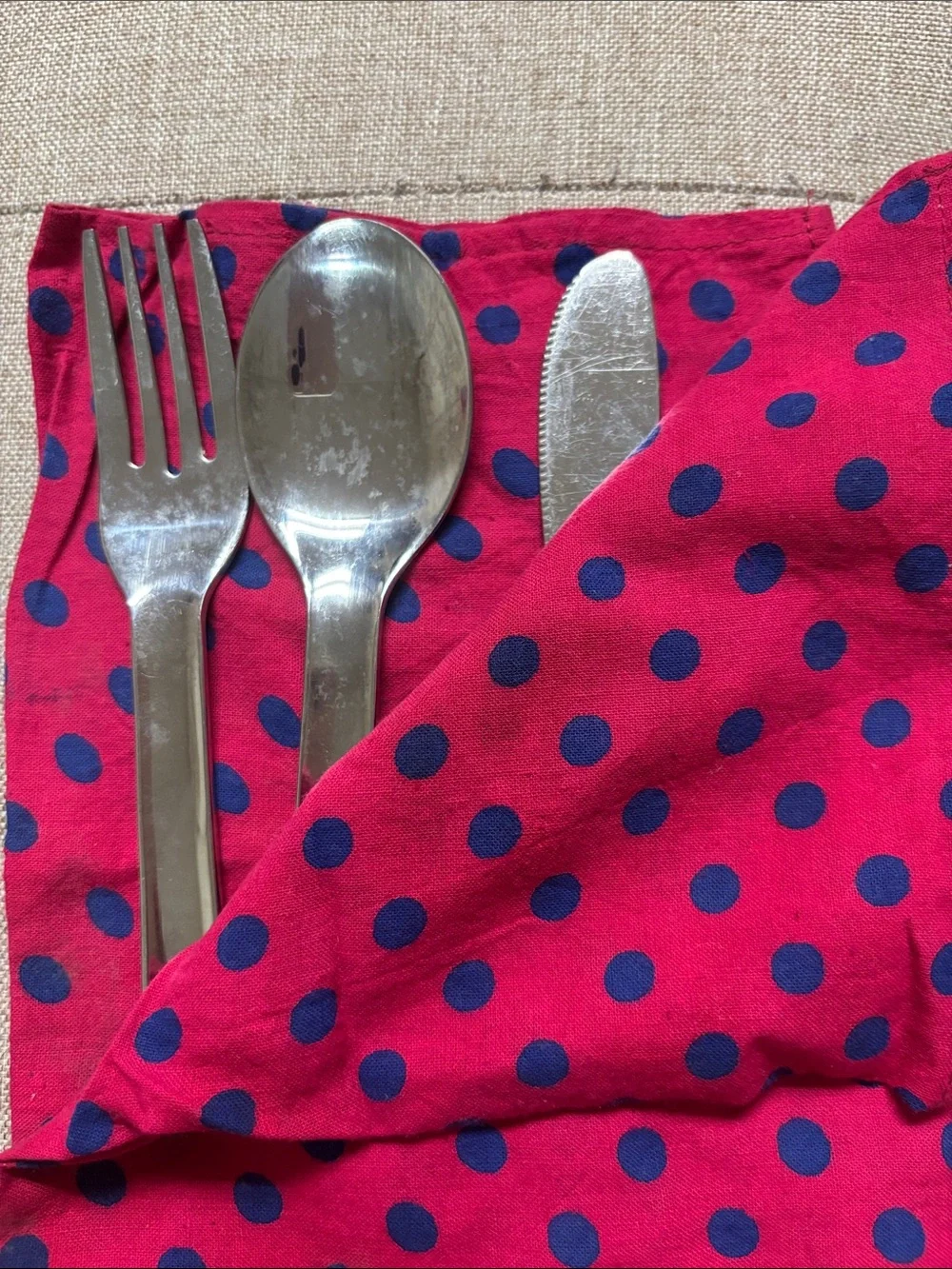 Stainless steel set(fork, spoon, knife) and napkin.